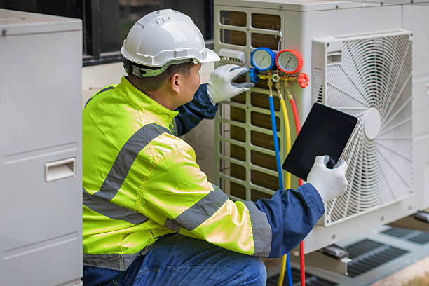 Professional Air Conditioning Repair technician working in Bennington, IN